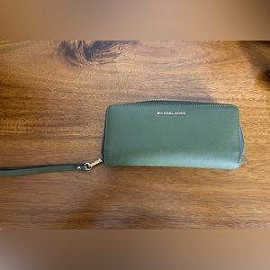 Michael Kors Large travel continental wristlet wallet in Hunter green
